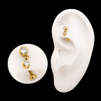 Bezel Gem Fixed Top Curved Barbell with Floating Gem Dangle – 24Kt Gold PVD Titanium.